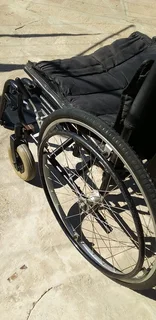 Wheelchair affordable,foldable,steel frame heavy duty with detachable foot rest pedals.
