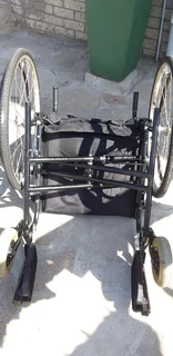 Wheelchair affordable,foldable,steel frame heavy duty with detachable foot rest pedals.