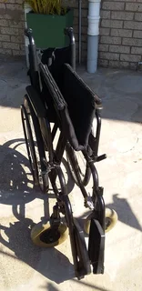 Wheelchair affordable,foldable,steel frame heavy duty with detachable foot rest pedals.
