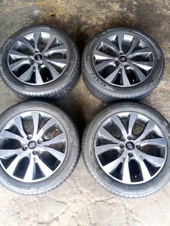 We are selling a set of clean 16 original Hyundai accent mag rims with new tyres 195/50 16 Kumho,
