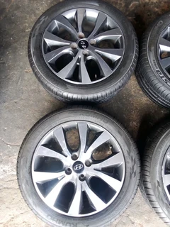 We are selling a set of clean 16 original Hyundai accent mag rims with new tyres 195/50 16 Kumho,