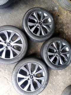 We are selling a set of clean 16 original Hyundai accent mag rims with new tyres 195/50 16 Kumho,