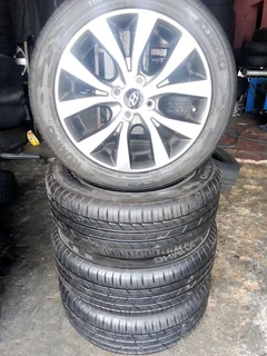We are selling a set of clean 16 original Hyundai accent mag rims with new tyres 195/50 16 Kumho,