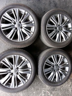 We are selling a set of clean 16 inch as good as new Suzuki mag wheels with 90% Bridgestone tyres