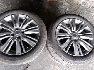 We are selling a set of clean 16 inch as good as new Suzuki mag wheels with 90% Bridgestone tyres