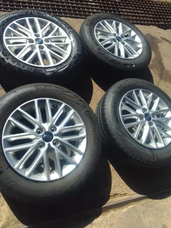 15 inch clean original ki a rio mag rims with good tyres in a very good condition