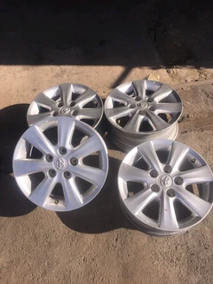 We are selling a set of 15 inch original Toyota Corolla quest mag rims in a very good condition.