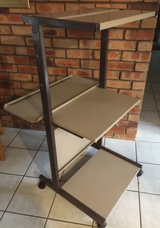 Computer and printer stand on castor wheels for easy mobility. All metal construction, robust design
