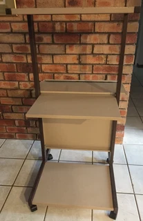 Computer and printer stand on castor wheels for easy mobility. All metal construction, robust design