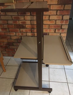 Computer and printer stand on castor wheels for easy mobility. All metal construction, robust design