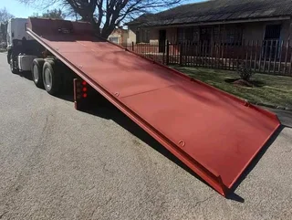 TOW TRUCK MANUFACTURER ROLL BACK FLOOR