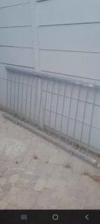 Galvanized Security Fencing with Spikes.