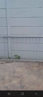 Galvanized Security Fencing with Spikes.