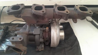 Nissan TD27 Turbo with manifold for sale.