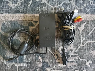 PlayStation 2 power brick and AV adapter - R50