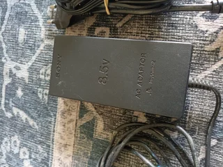 PlayStation 2 power brick and AV adapter - R50