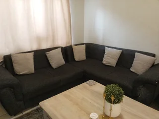 L shape couch R700 dent in two of the seats great for reupholster project.