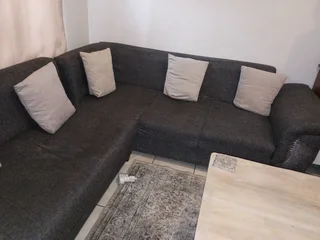 L shape couch R700 dent in two of the seats great for reupholster project.