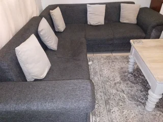 L shape couch R700 dent in two of the seats great for reupholster project.