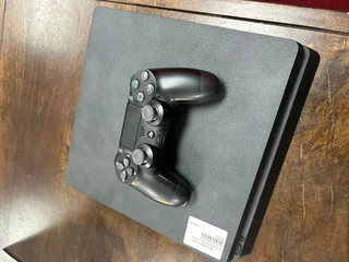 Like New Hardly used PlayStation 4 Slimline, 1tb with all its Cables included in Sale..