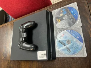 Like New Hardly used PlayStation 4 Slimline, 1tb with all its Cables included in Sale..