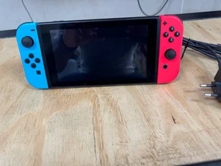 Like New, Hardly Used, As Good as New Nintendo Switch Red and Blue V2 with Original USB C Charger..