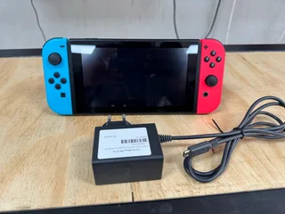 Like New, Hardly Used, As Good as New Nintendo Switch Red and Blue V2 with Original USB C Charger..