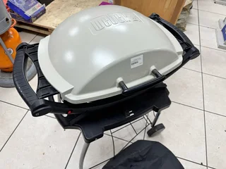 In Brand New Condition Webber Q200 Gas Grill complete with Stand and Weather Cover for Sale…