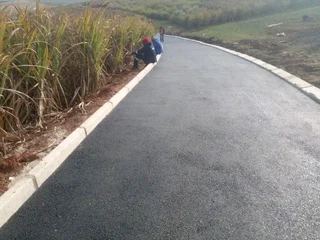 TARRING ROADS N DRIVEWAYS