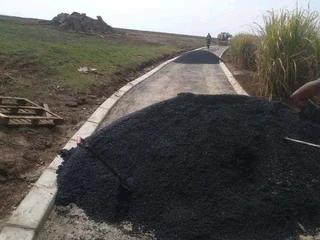 TARRING ROADS N DRIVEWAYS