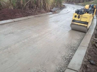 TARRING ROADS N DRIVEWAYS