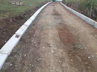 TARRING ROADS N DRIVEWAYS