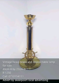 Vintage heavy brass and bronze table lamp for sale.