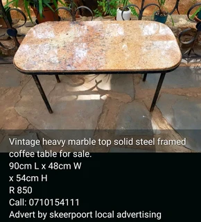 Heavy marble top solid steel framed coffee table for sale.