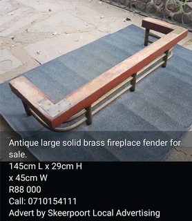 Antique large solid brass fireplace fender for sale.