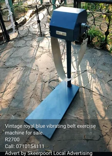 Vintage royal blue vibrating belt exercise machine for sale.