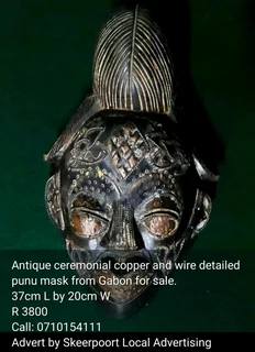 Antique ceremonial copper and wire detailed punu mask from Gabon for sale