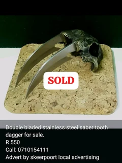 Double blades stainless steel saber tooth dagger for sale.