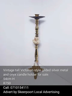 Vintage tall Victorian style gilded silver metal and onxy candle holder for sale.