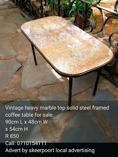 Vintage heavy marble top solid steel framed coffee table for sale.