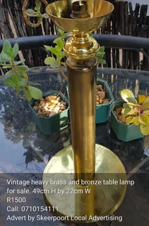 Vintage heavy brass and bronze table lamp for sale.