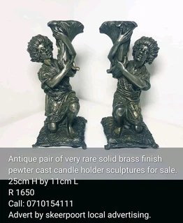 Antique pair of very rare brass finish pewter cast candle holder sculptures for sale.
