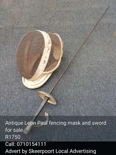 Antique Leon Paul fencing mask and sword for sale.