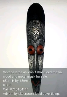 Vintage African Ashanti ceremonial wood and metal mask for sale.