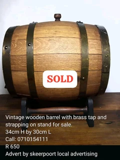Vintage 1909 wooden barrel with brass tap and strapping on stand for sale