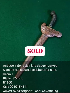 Antique Indonesian kris dagger, carved wooden handle and scabbard for sale