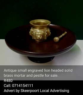 Antique small engraved lion headed solid brass mortar and pestle for sale