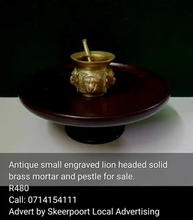 Antique small engraved lion headed solid brass mortar and pestle for sale