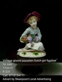Vintage glazed porcelain Dutch girl figurine for sale