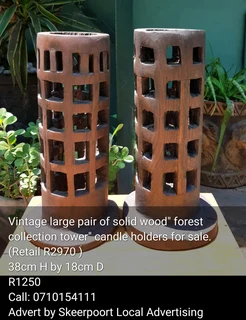 Vintage large pair of solid wood" forest collection tower"candle holders for sale.